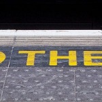 MIND THE GAP written on railway platform edge